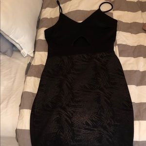 black mini dress with open cut on chest